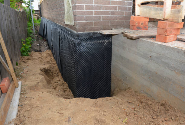 Happy homeowners after waterproofing job in Fort Washington